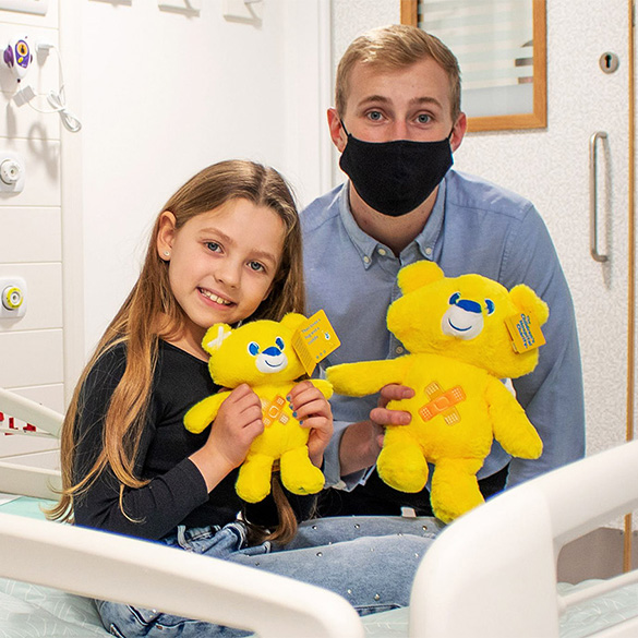 Patient Myla-Mae with a staff member from Sheffield Children's Hospital